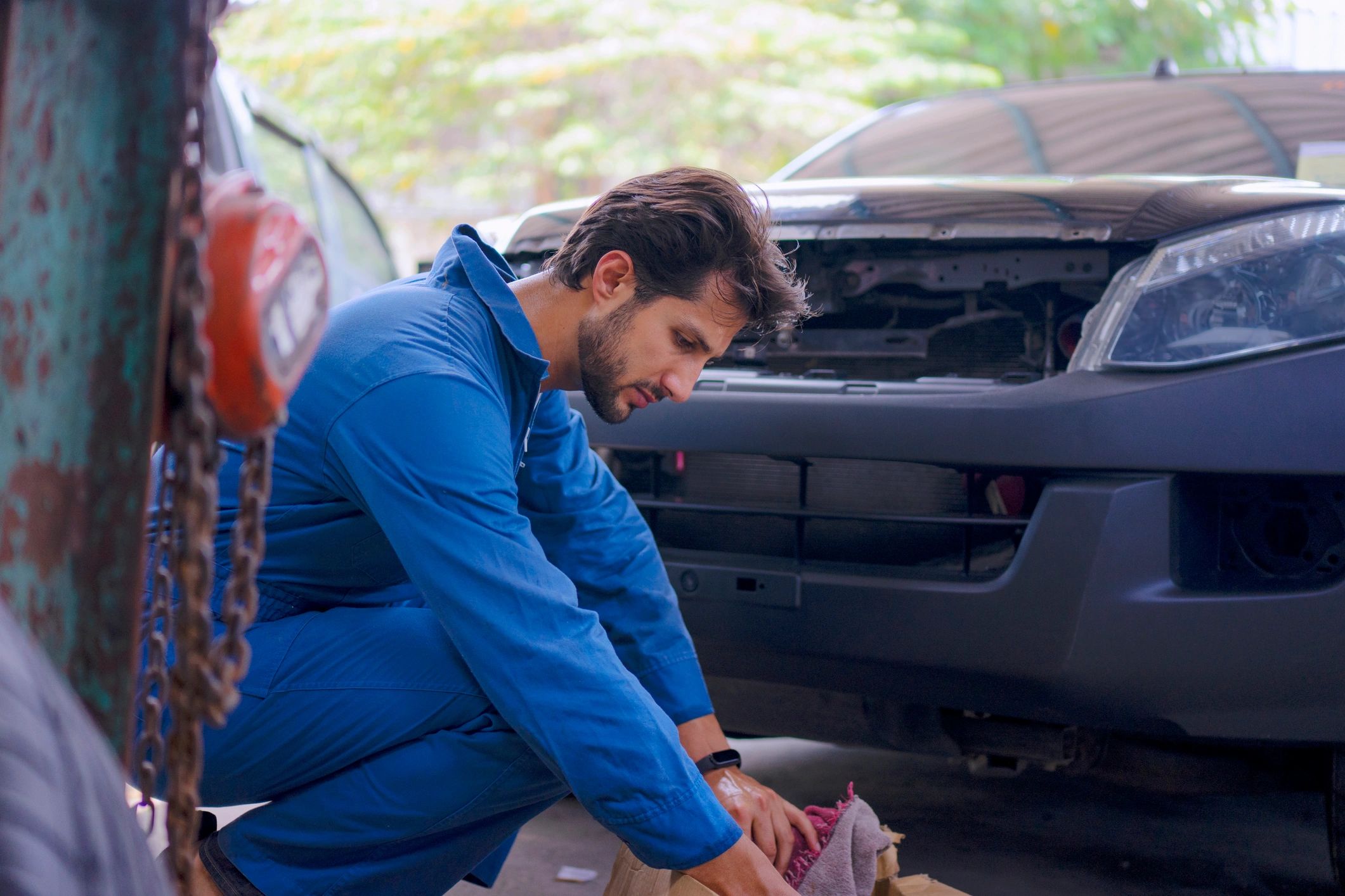 Mechanic working at a car garage